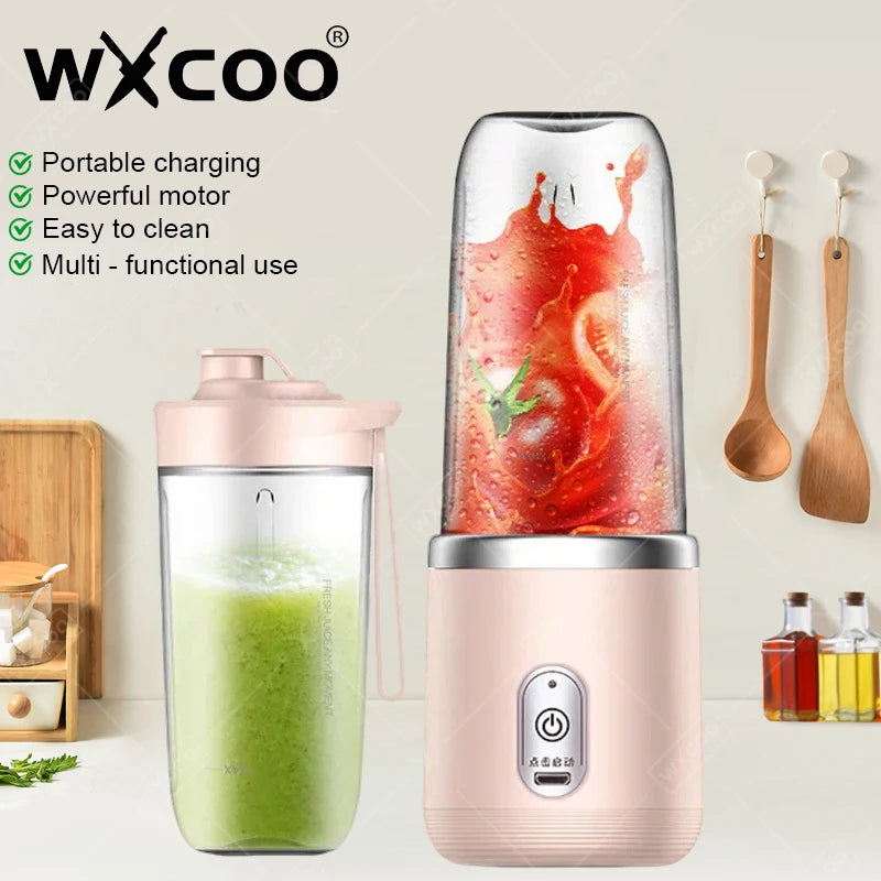 Portable electric blender in soft pink, featuring a clear cup with blending results and a compact, modern design.