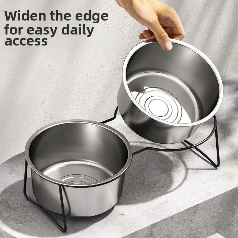 Silver stainless steel elevated slow feeder dog bowls on a black metal stand.