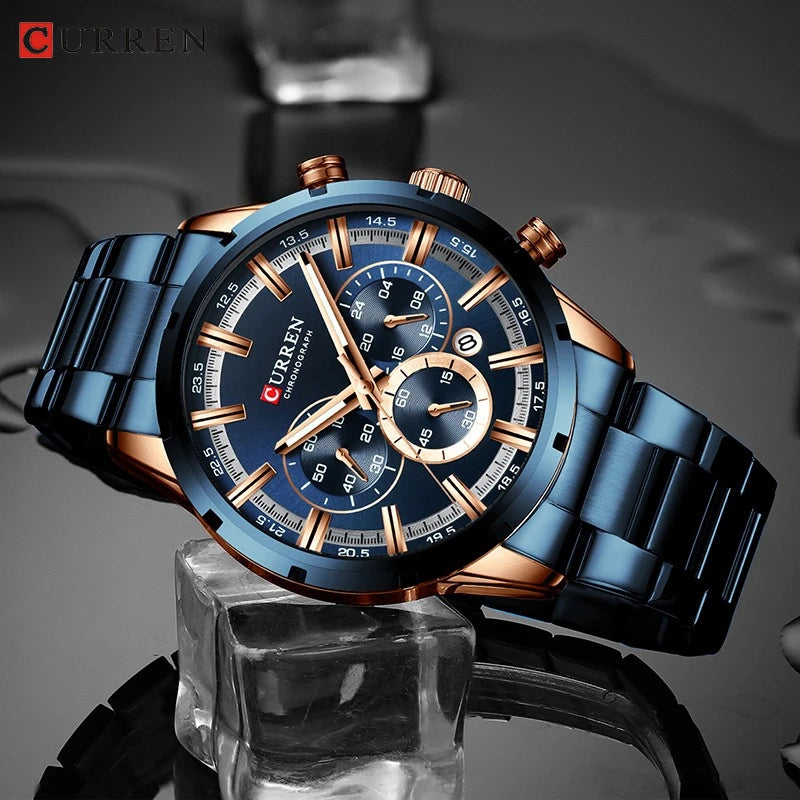 CURREN blue and rose gold chronograph wristwatch with metal link band and round dial.