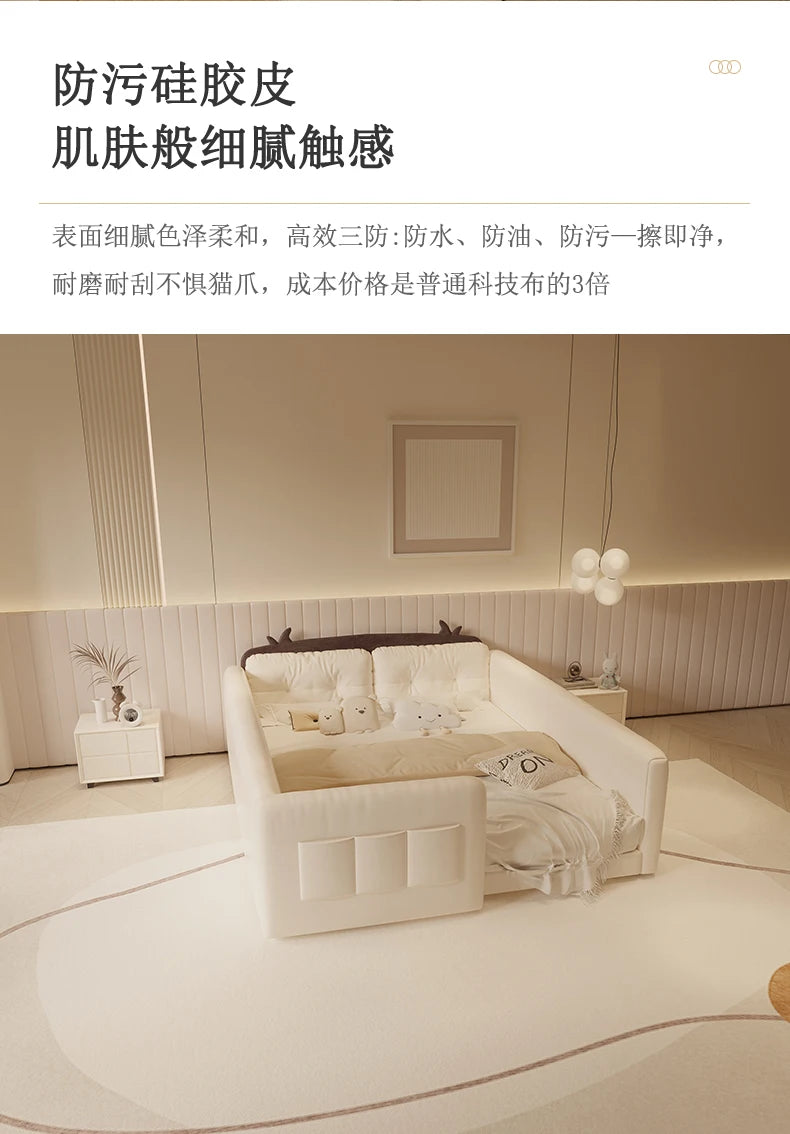 Cream-coloured parent-child bed with cute cow-ear headboard, protective side guardrails, and soft, wipe-clean fabric.