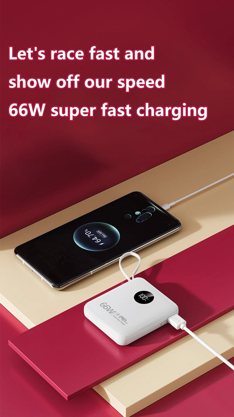 A white, square portable power bank with a digital battery display, charging a smartphone via a built-in cable.