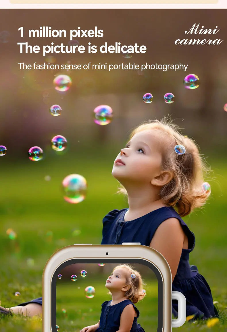 Gold-colored mini digital camera with a screen displaying a photo of a young girl with bubbles.