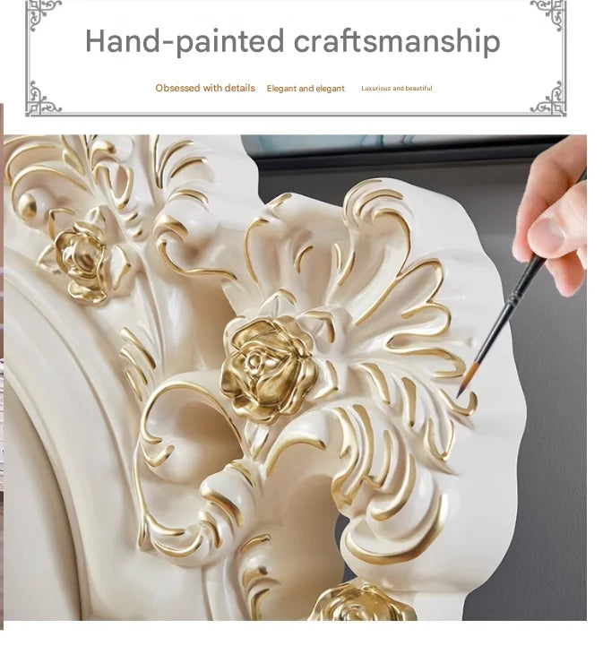 Close-up of a white luxury princess bed headboard featuring intricate, hand-painted gold floral carvings.