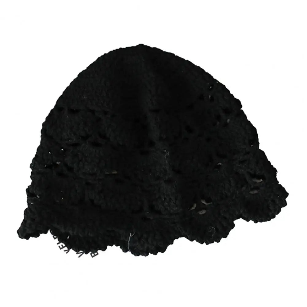 Black women's beanie hat in a delicate hollow crochet lace design with a scalloped edge.