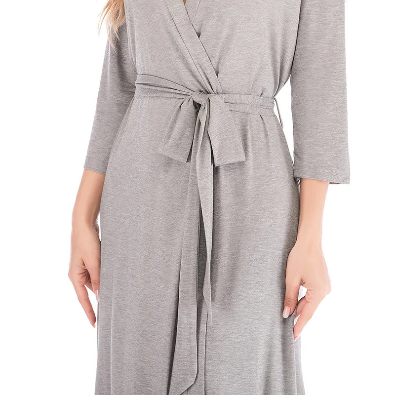 Soft grey jersey wrap robe featuring three-quarter sleeves and a matching tie-waist belt.
