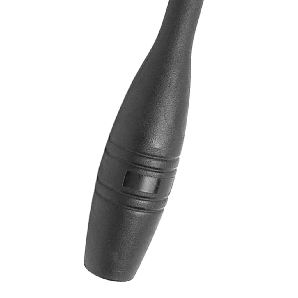 Close-up of a matte black Indian clubbell with a textured, ergonomic handle and grooved detailing.