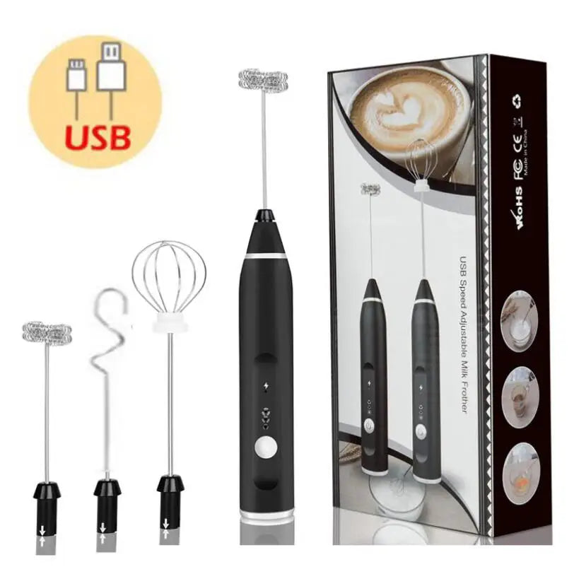 Black USB-rechargeable electric milk frother with three interchangeable whisk heads, shown with its retail packaging.
