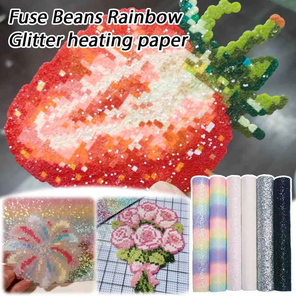 A variety of colourful, sparkly glitter sheets for fuse bead projects, featuring floral and strawberry pixel designs.