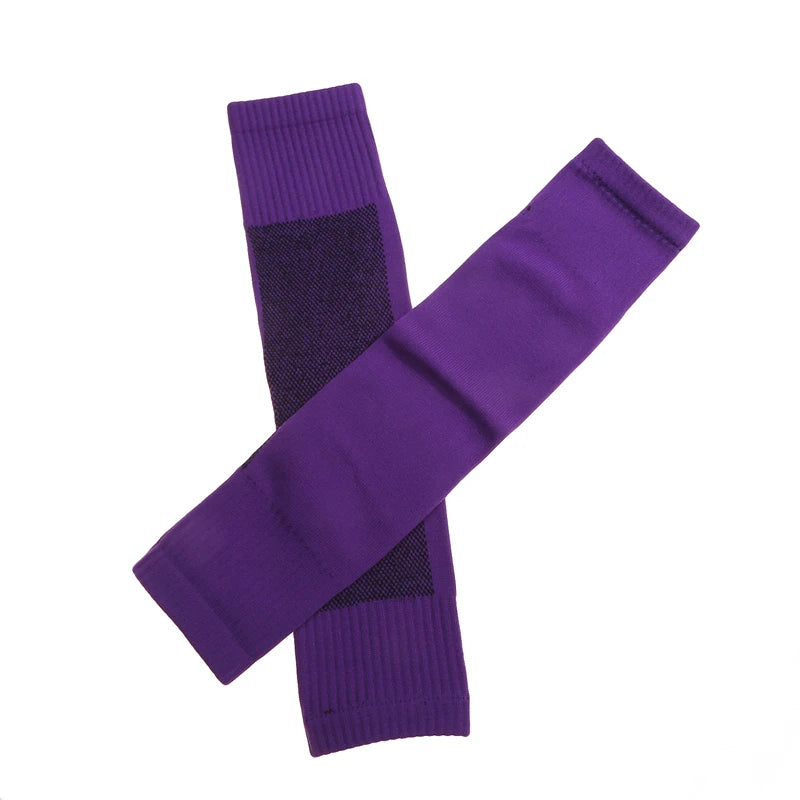 Pair of purple athletic compression sleeves with ribbed cuffs and textured detailing for improved grip.