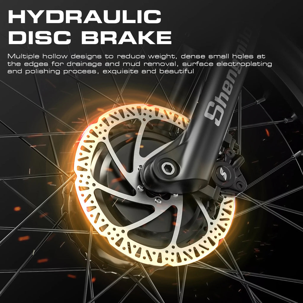 Black Shengmilo electric bike hydraulic disc brake with a vented silver rotor attached to spoked wheel.