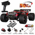Red and black 1:16 RC monster truck with rugged tires, remote control, two batteries, and replacement parts.