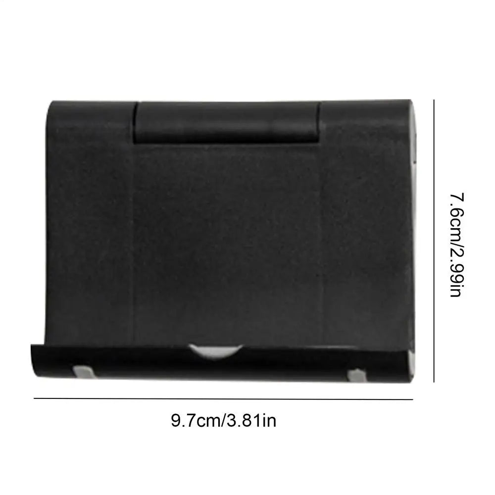 Black foldable plastic phone and tablet stand with dimensions 9.7cm x 7.6cm.