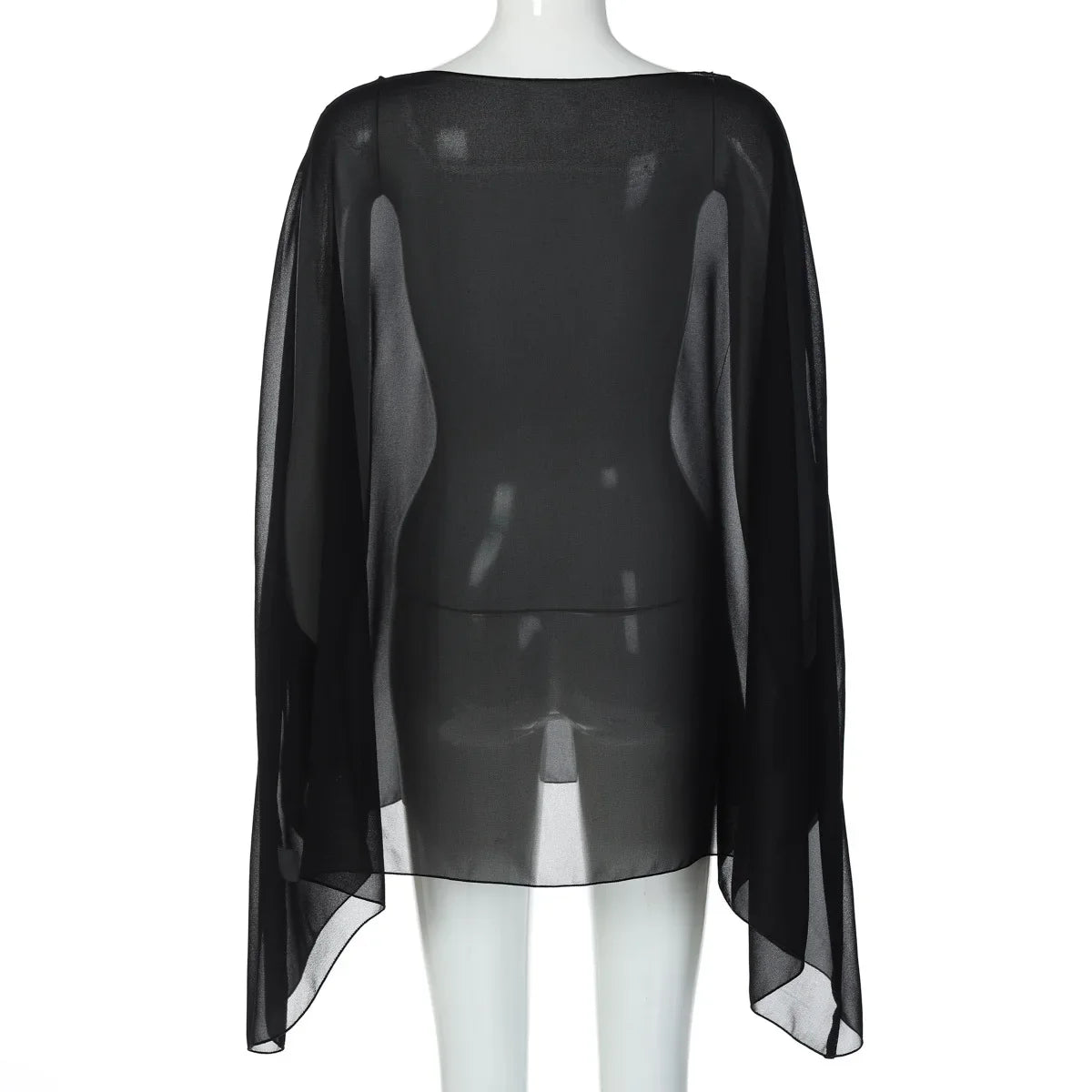 Sheer black chiffon poncho-style cover-up with a loose, flowing silhouette and a straight hemline on a mannequin.