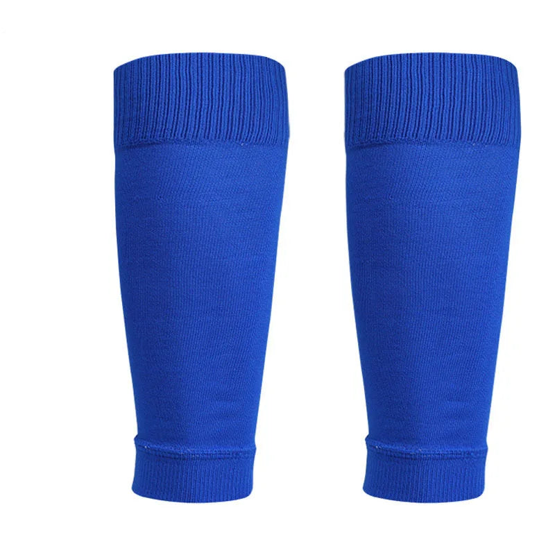 Pair of royal blue football sports socks with ribbed cuffs, isolated on a white background.