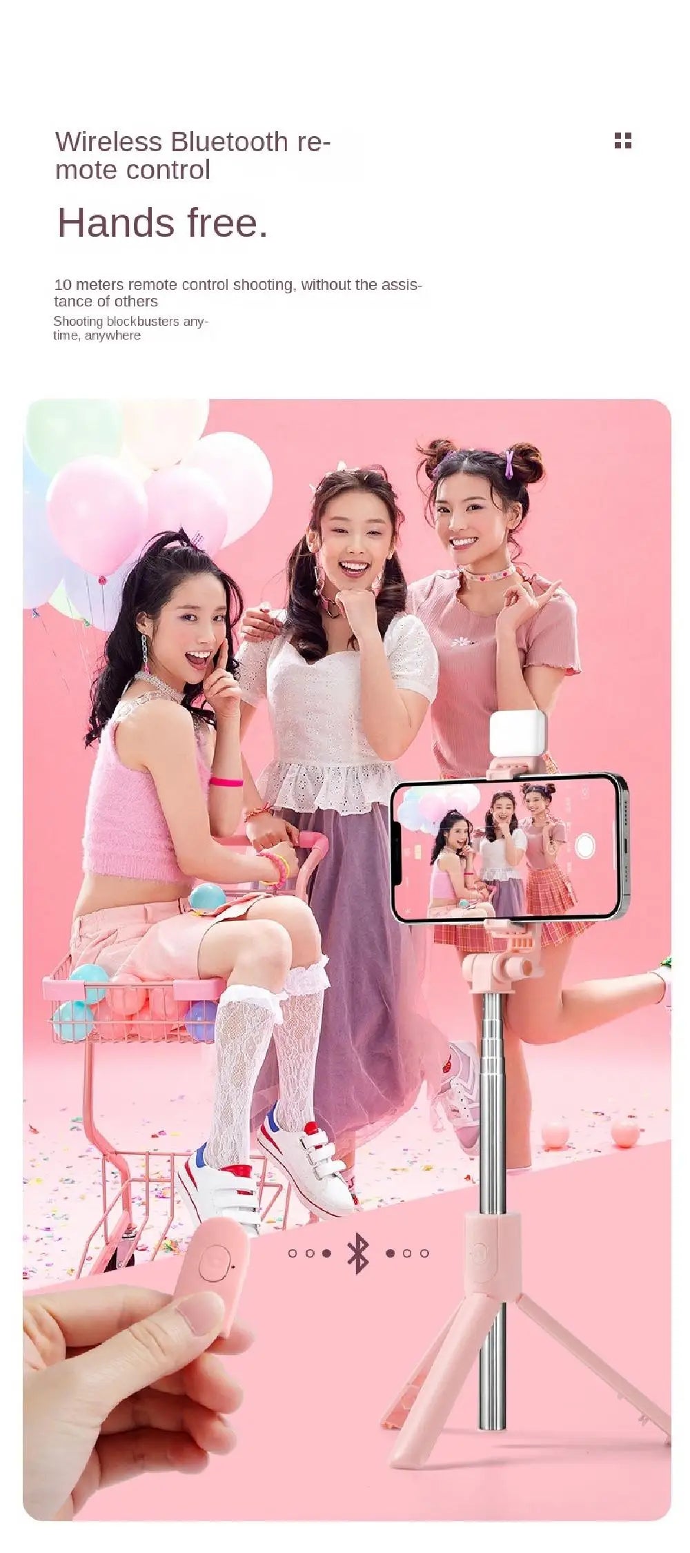 Pink wireless Bluetooth phone tripod stand with integrated fill light and remote shutter control for selfies.