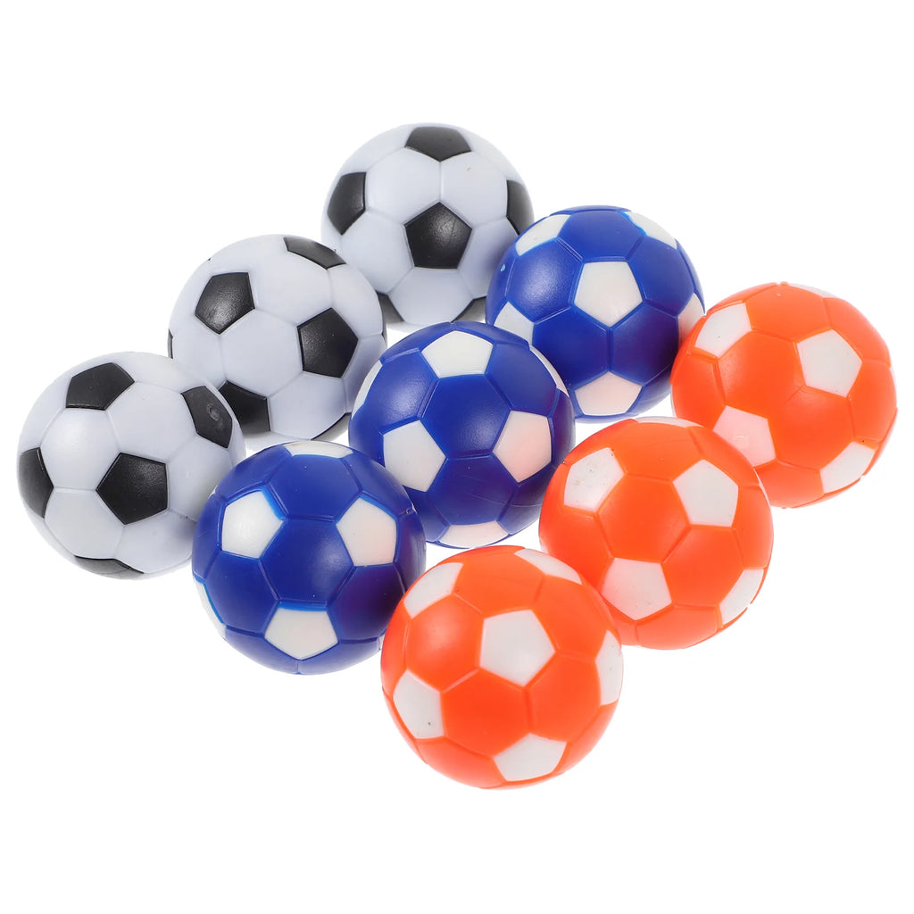 Set of small football-style sports balls in black and white, blue and white, and orange and white.