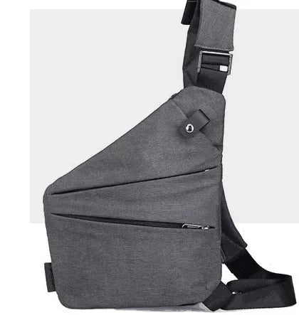 Charcoal grey, slim-profile anti-theft sling bag with an adjustable strap and secure zipped pockets.