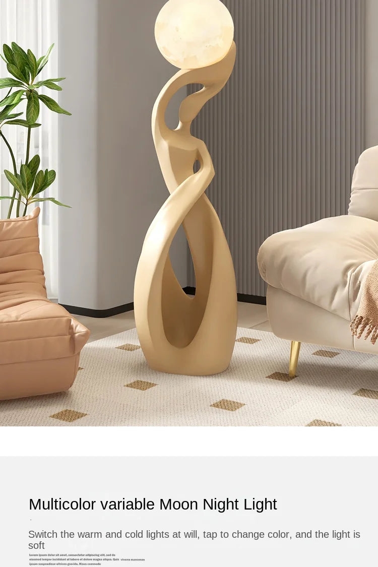 Cream-coloured abstract resin floor statue featuring a graceful, sculptural silhouette holding a glowing moon lamp.