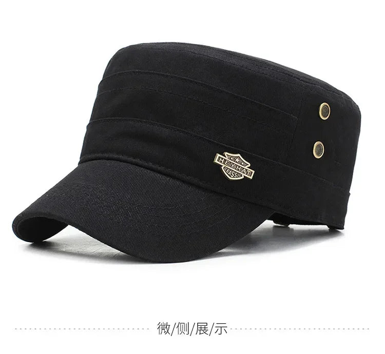 Black cotton military-style cadet cap with a flat top, curved peak, and decorative gold-tone side detail.