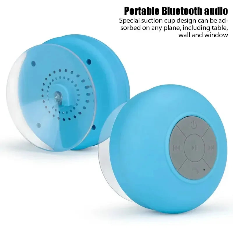 Blue wireless waterproof Bluetooth speaker with a built-in suction cup and grey control buttons.
