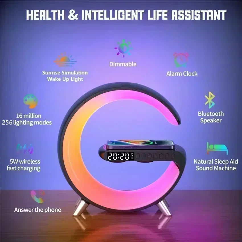 Black G-shaped wireless charging stand with LED alarm clock, Bluetooth speaker, and multicoloured ambient lighting.