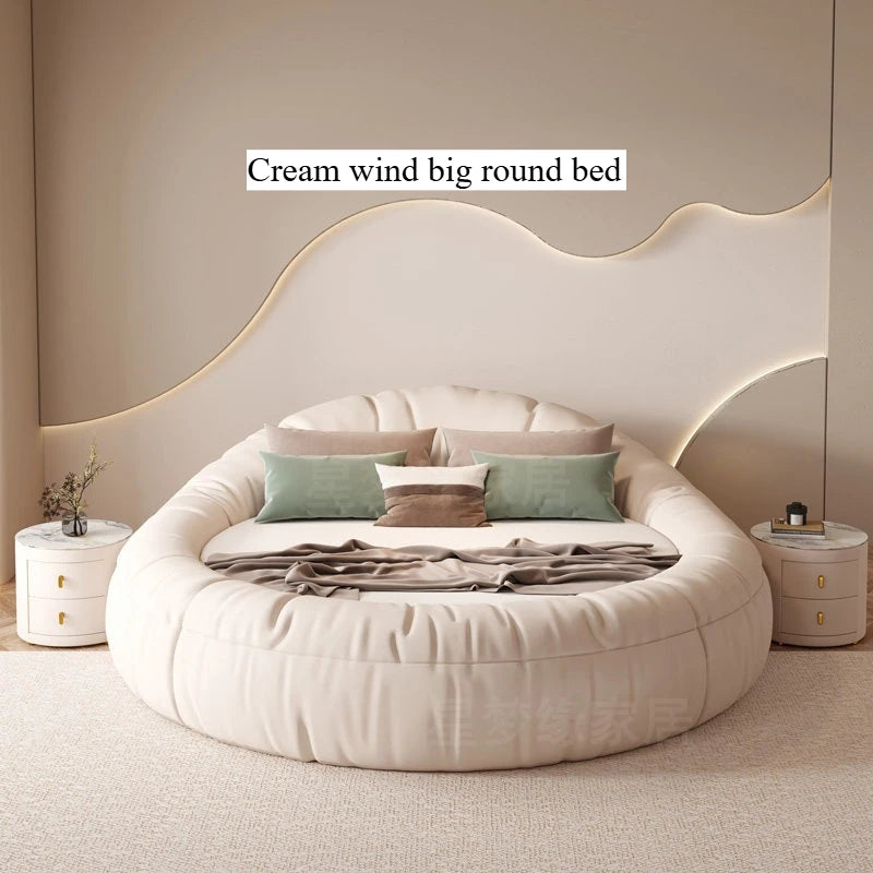 Modern cream-coloured round bed frame with a tufted, cushioned border, creating a minimalist, luxurious look.