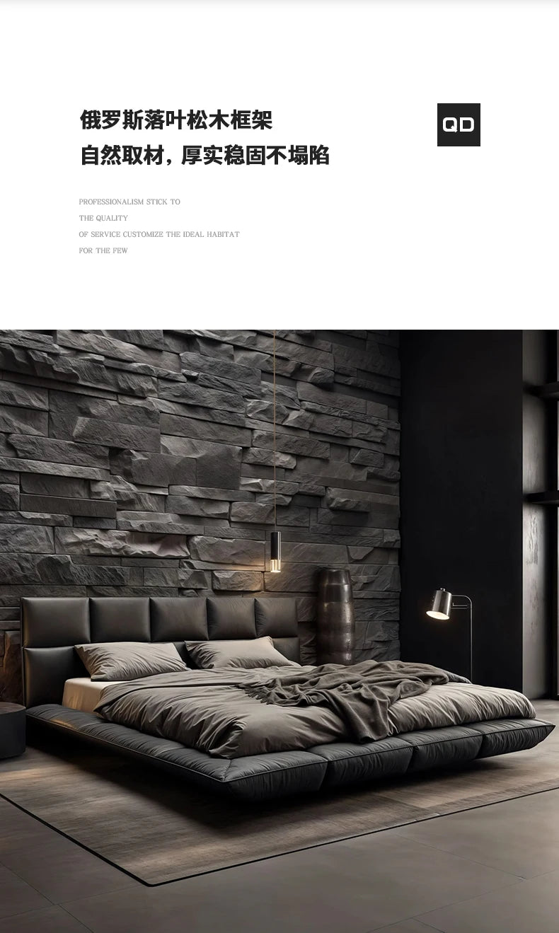 A modern, king-size floating bed upholstered in dark leather with a tufted headboard, set against a dark stone wall.