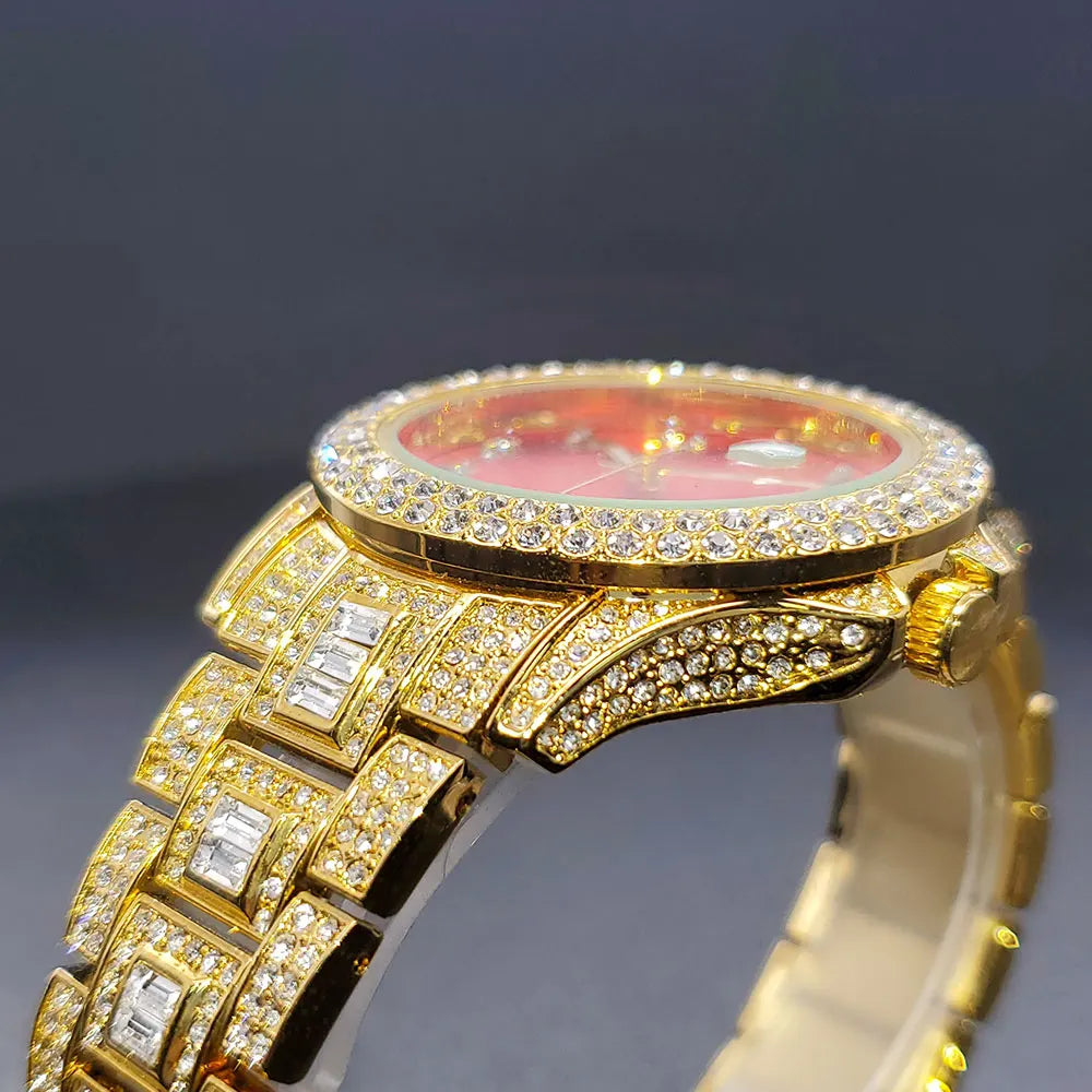 Women's gold-tone watch featuring a vibrant red face and a band encrusted with sparkling diamond-effect stones.