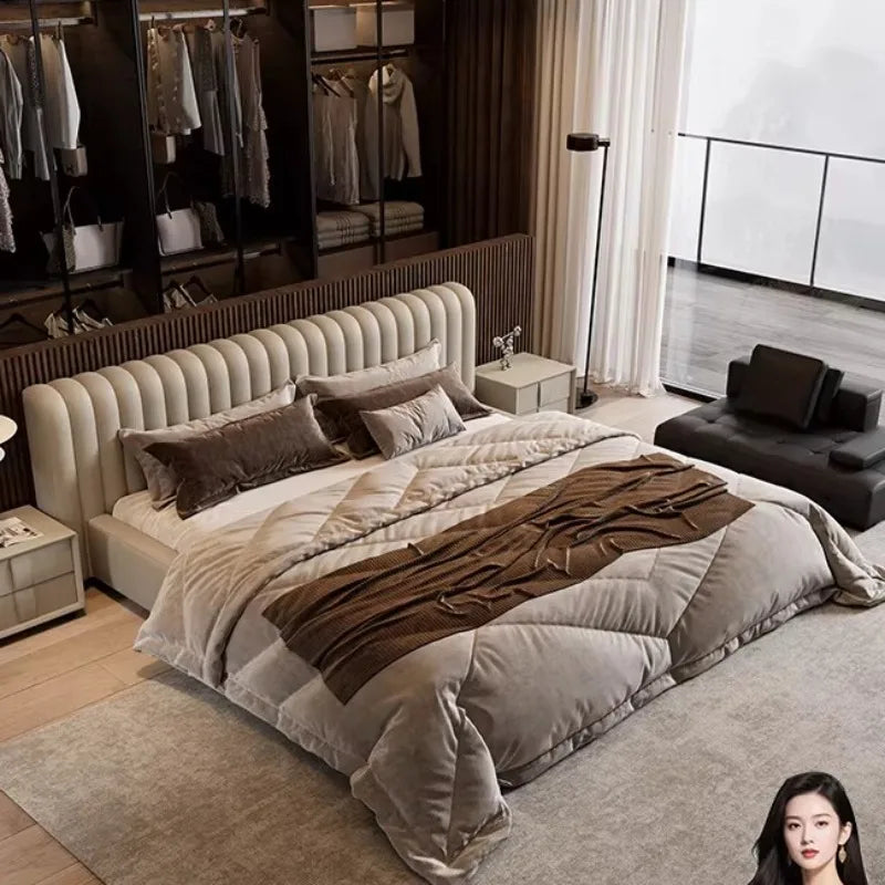 Modern cream fabric storage bed with a tall, vertically panelled, rounded headboard in a stylish bedroom setting.