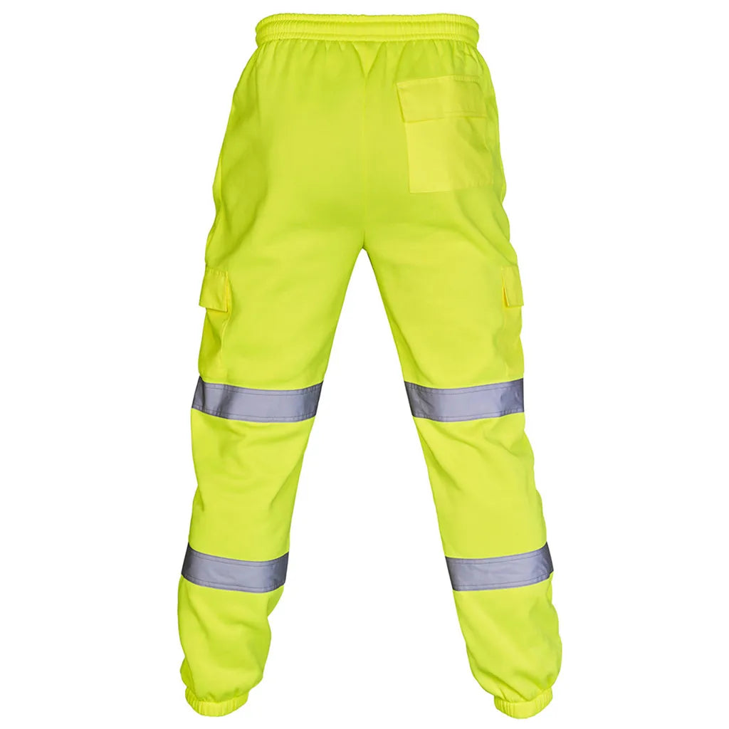Men's high-visibility yellow cargo work trousers with elasticated waist, side pockets, and dual reflective leg bands.