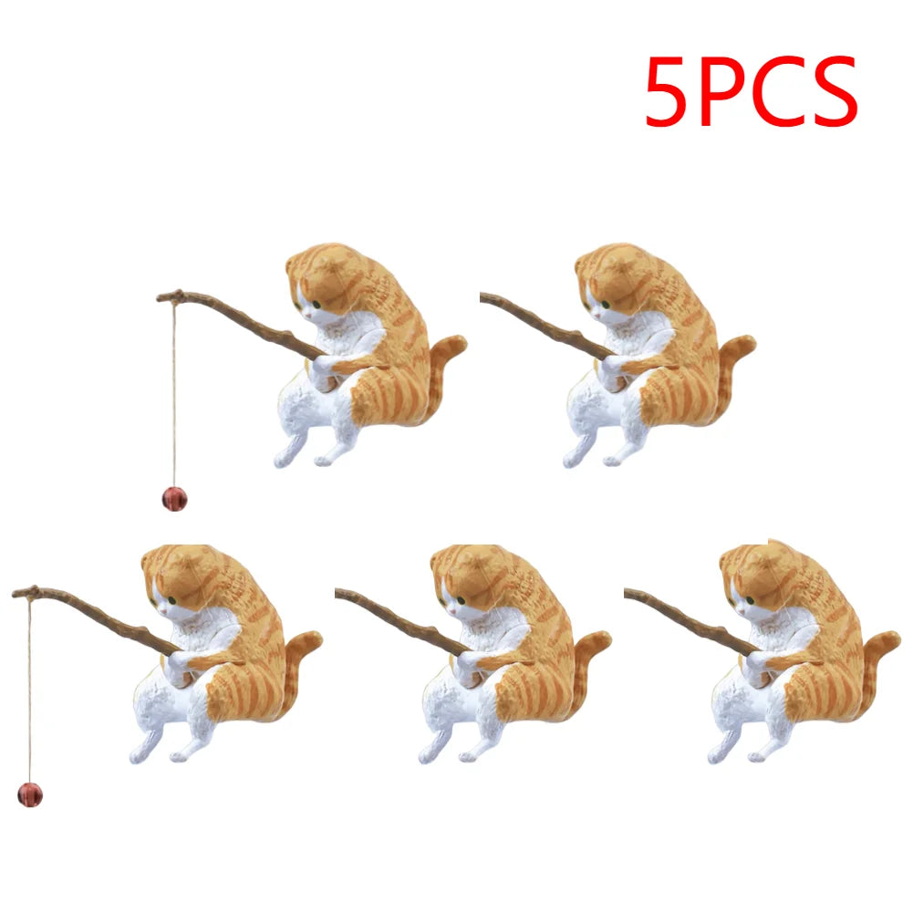A set of 5 cute, orange tabby cat aquarium ornaments, each holding a small wooden fishing rod.