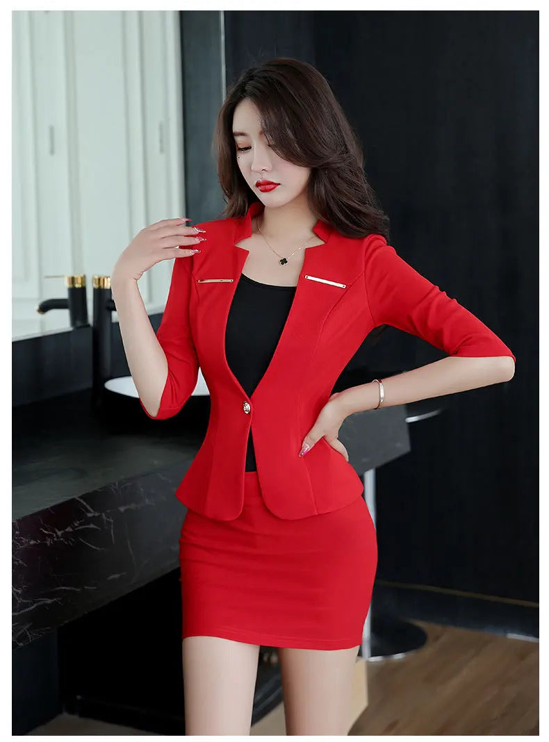 Elegant red suit set featuring a tailored blazer with 3/4 sleeves, metal accents, and a matching pencil mini skirt.