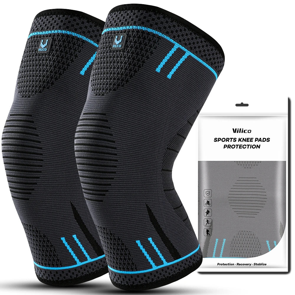 Two dark grey Vilico sports knee compression sleeves with blue accents, shown alongside their product packaging.