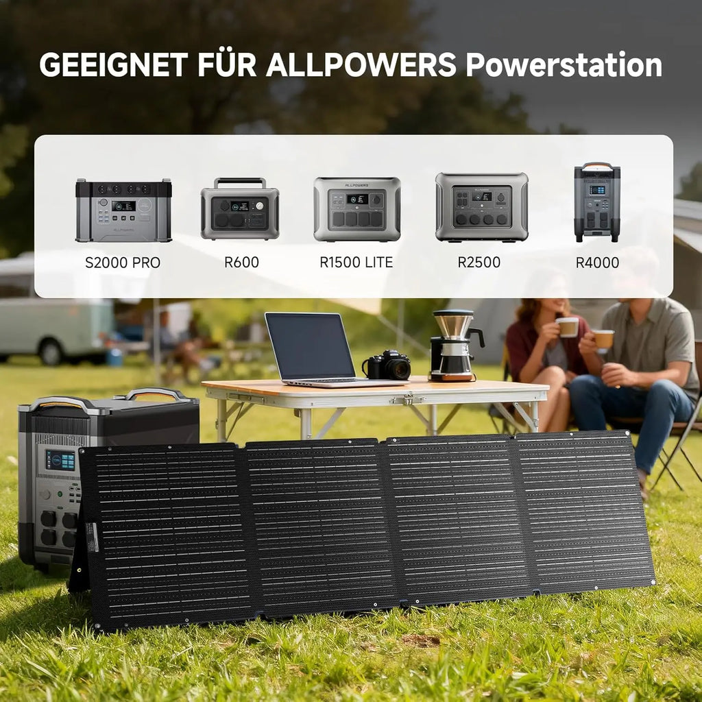 A portable solar panel set up on grass in front of an ALLPOWERS power station and a campsite table with a laptop.