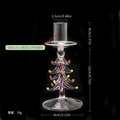 Clear borosilicate glass candlestick holder shaped like a Christmas tree with colorful glass ornaments.