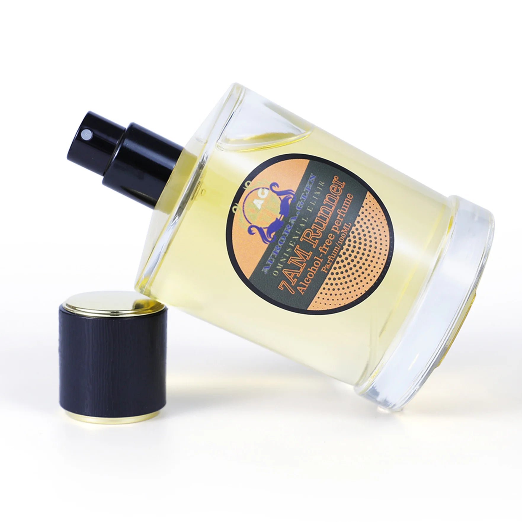 Clear 100ml glass perfume bottle with pale yellow liquid, black pump and cap, featuring a circular graphic label.