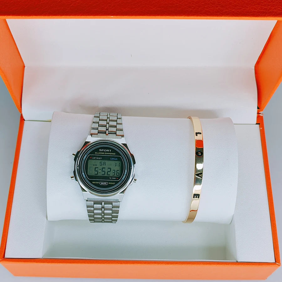 Retro silver digital watch with alarm features, paired with a gold-tone 'LOVE' bangle in an orange gift box.