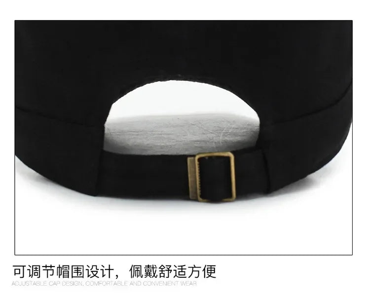 Back view of a black cotton baseball cap featuring an adjustable strap with a gold-tone metal buckle.