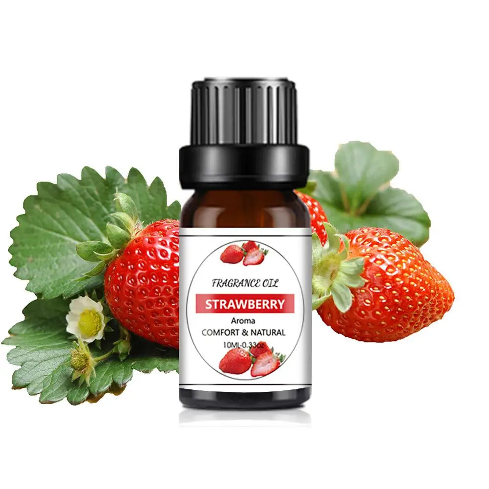 10ml bottle of strawberry fragrance oil with a black cap, displayed with fresh strawberries and green leaves.