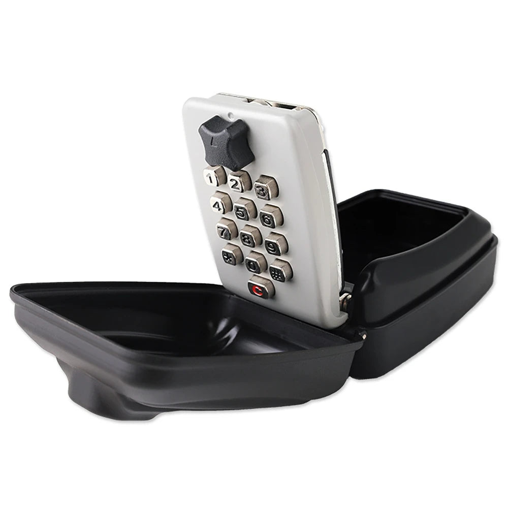 Open black metal key lock box with a light grey front panel featuring numbered push buttons and a black dial.