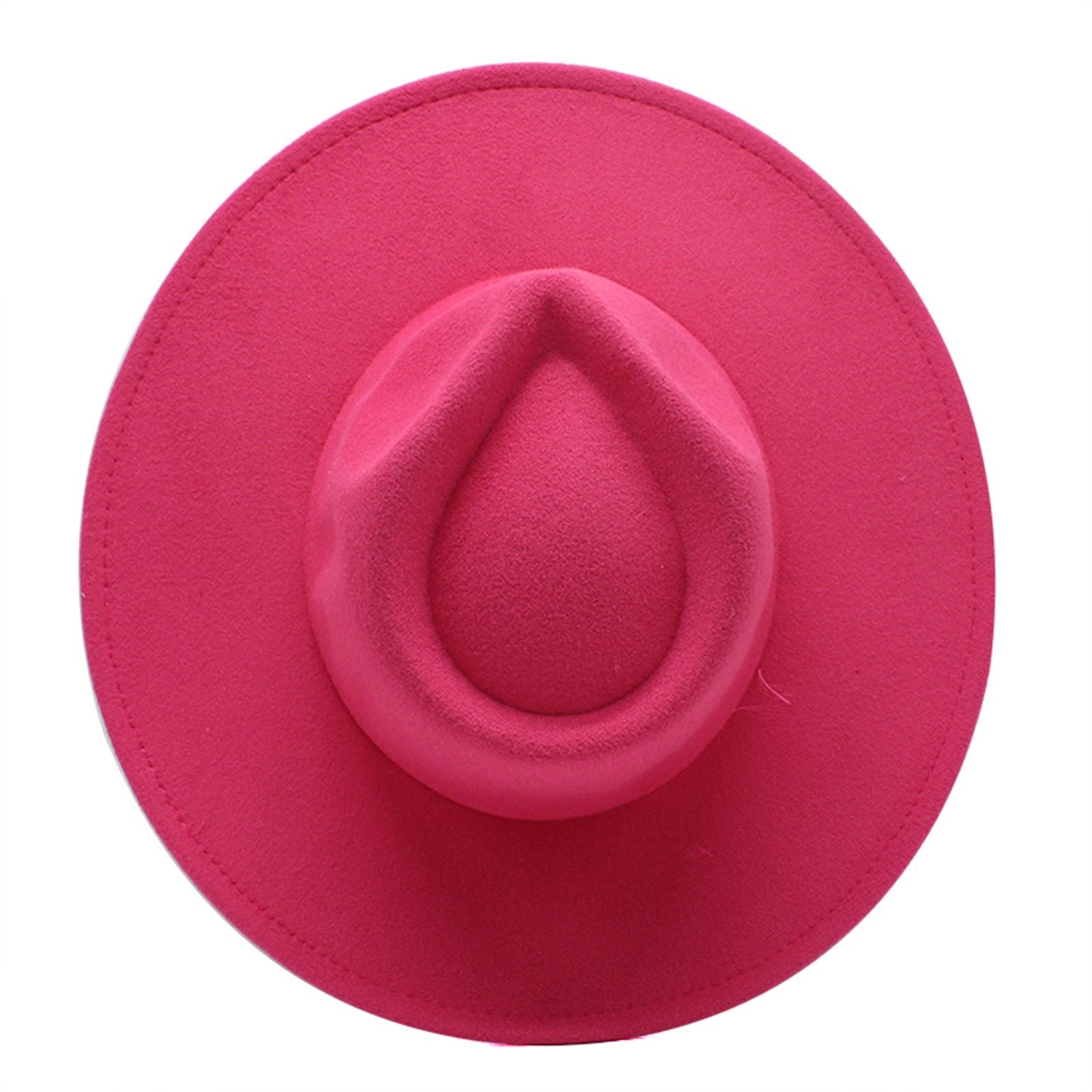 Top-down view of a bright pink vintage-style felt fedora hat with a pinched crown and wide brim.