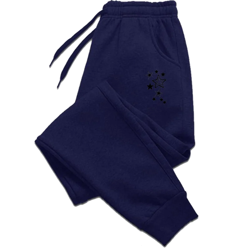 Navy blue joggers with an elastic drawstring waist, cuffed hems, and a small black star cluster print on the hip.