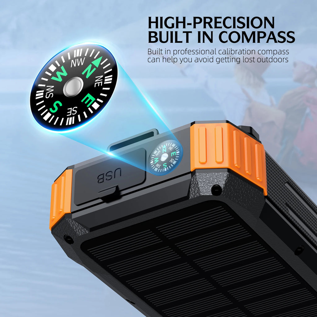 Rugged black and orange solar power bank with a built-in compass and USB charging port for outdoor use.