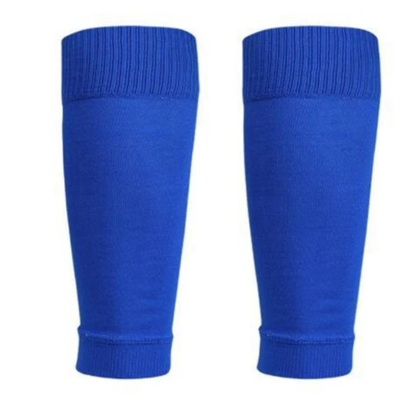 Pair of royal blue sports football sock sleeves with ribbed cuffs for secure fit.