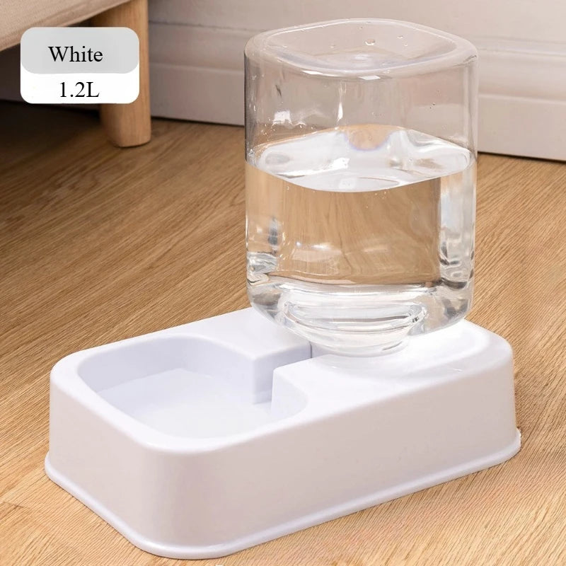 White 1.2L automatic pet water dispenser with a clear plastic reservoir and minimalist white base.